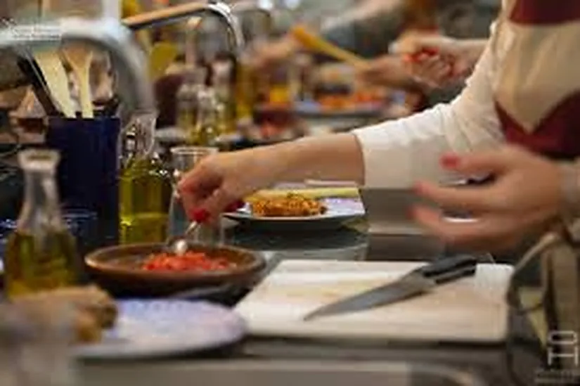 Plating Moroccan vegan dishes at the end of a private class